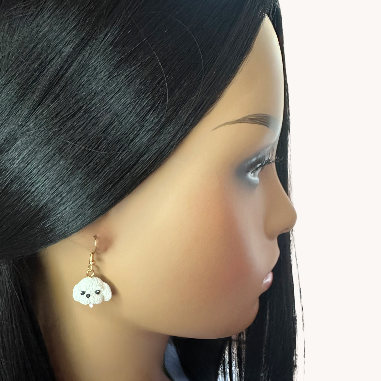 handmade polymer clay gold toned dangle earrings on model