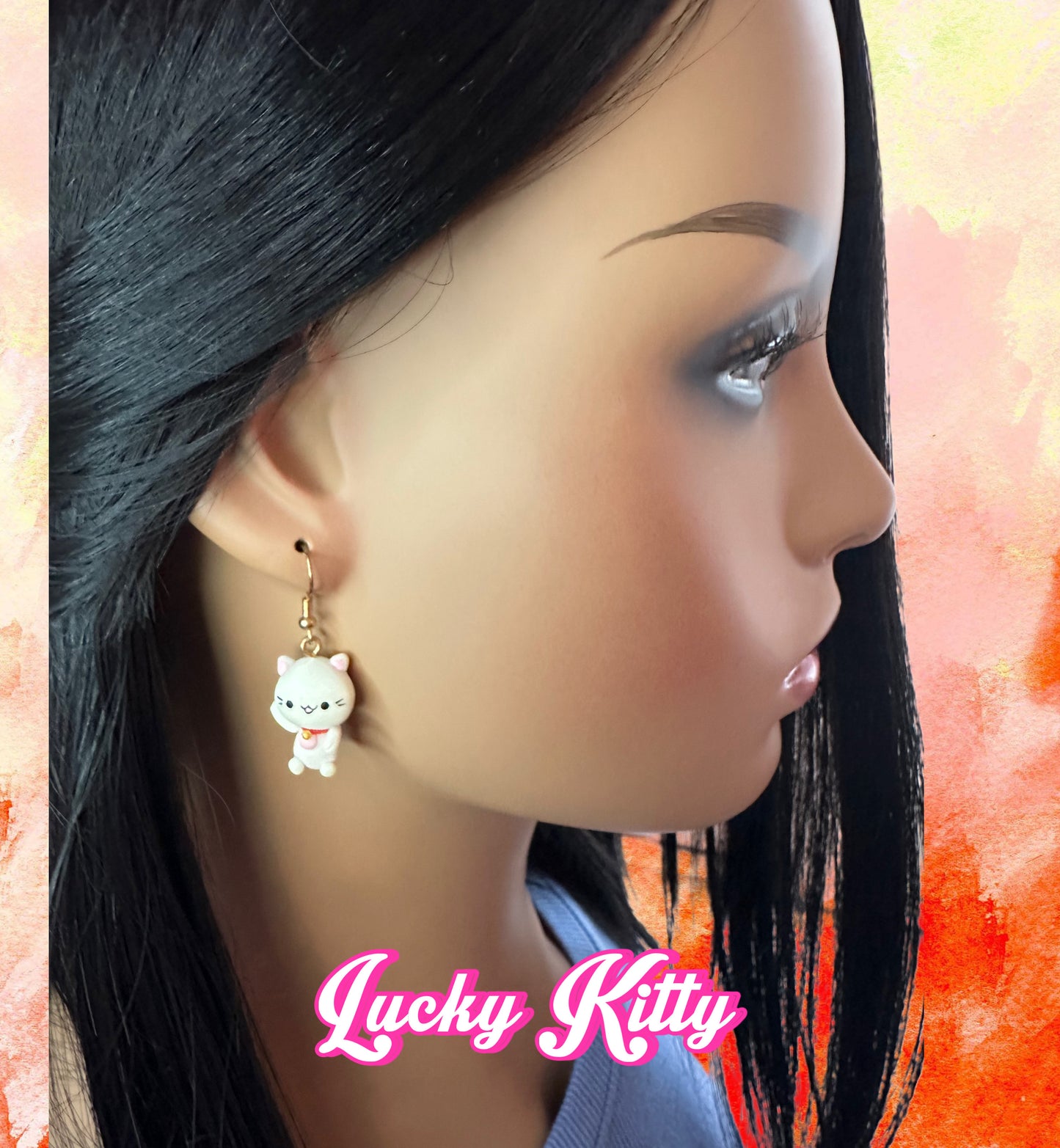 model wearing handmade lucky cat clay earrings