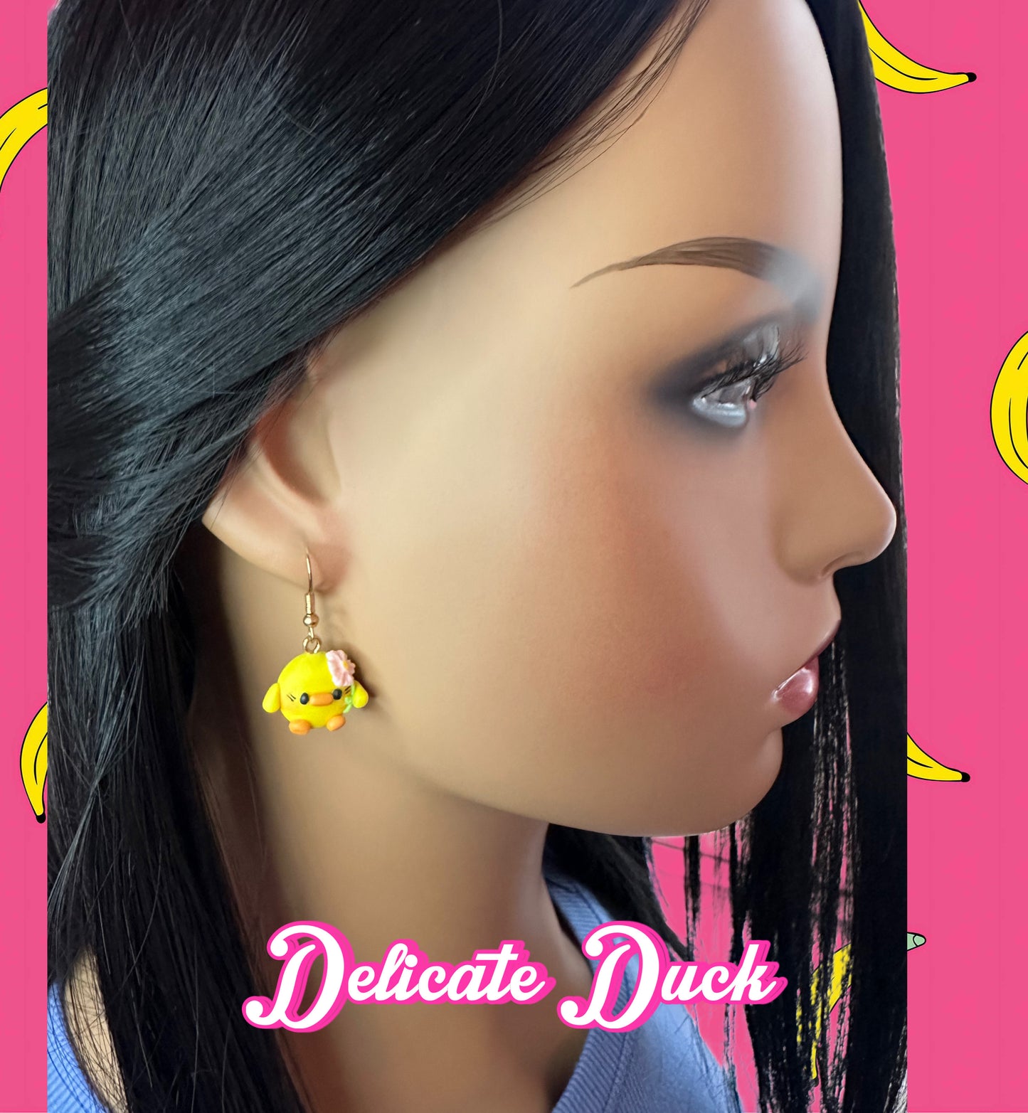 model wearing handmade kawaii clay duck dangle earrings