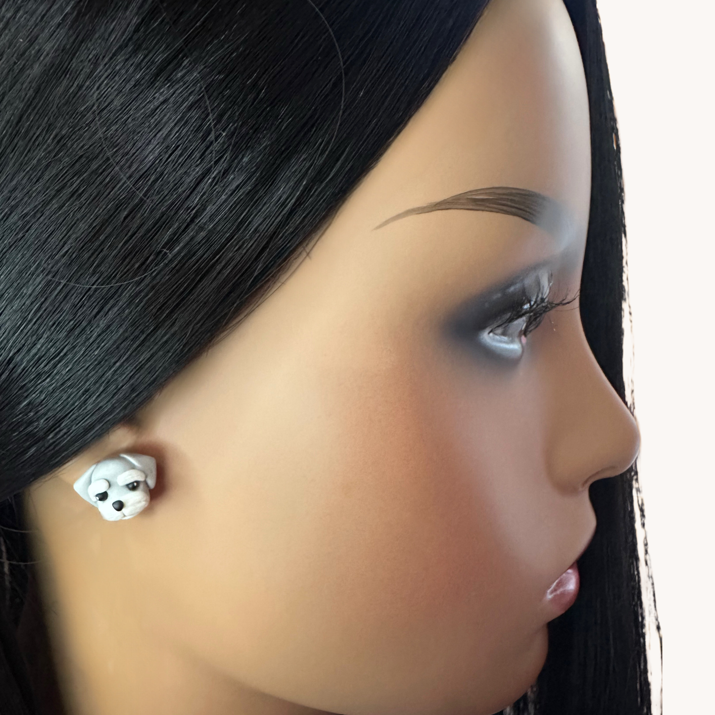 handmade polymer clay schnauzer stud earrings on model
