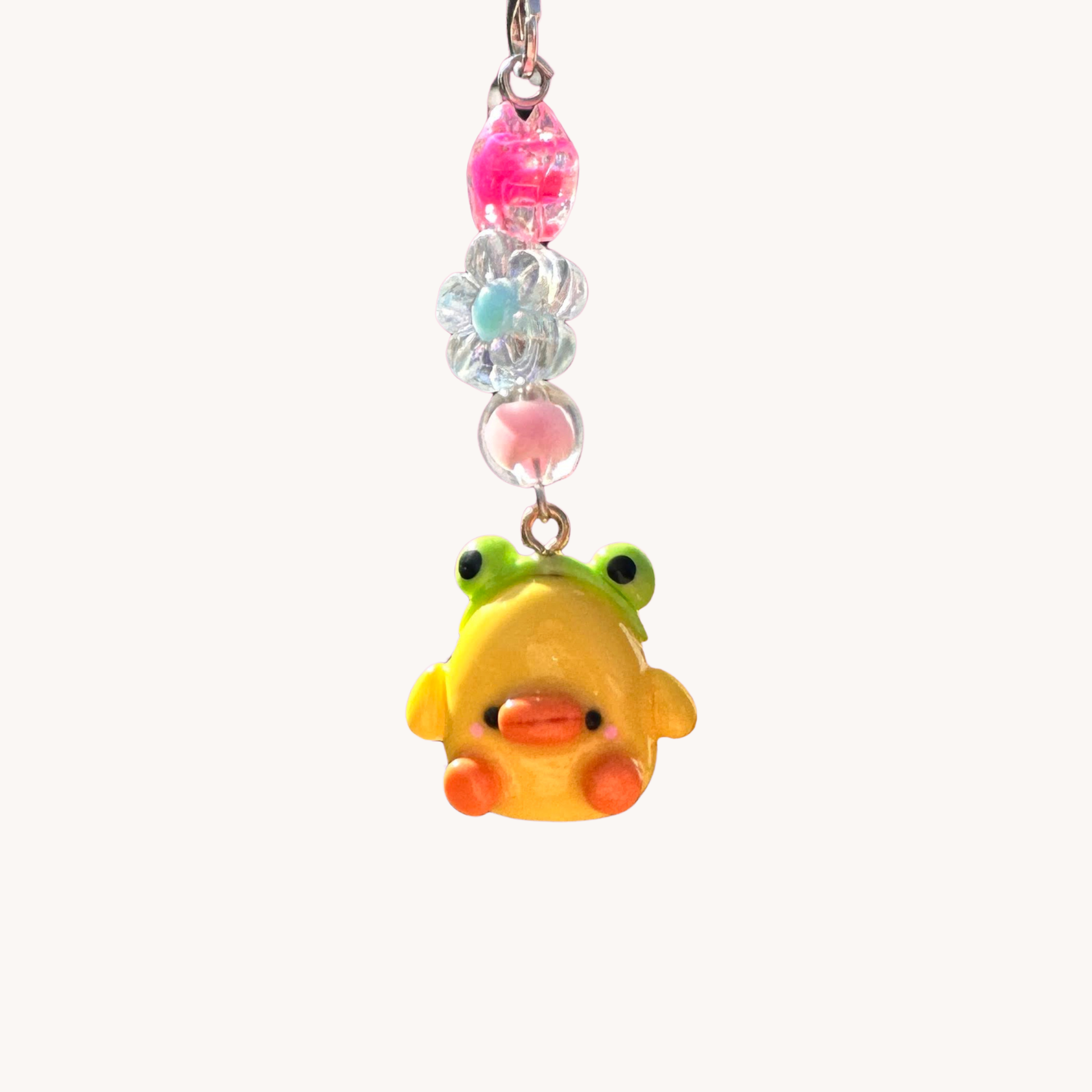 phone charm with colorful beads with duck and frog headband .