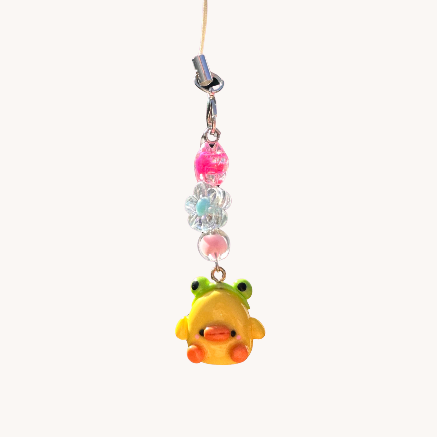 phone charm with colorful beads with duck and frog headband .