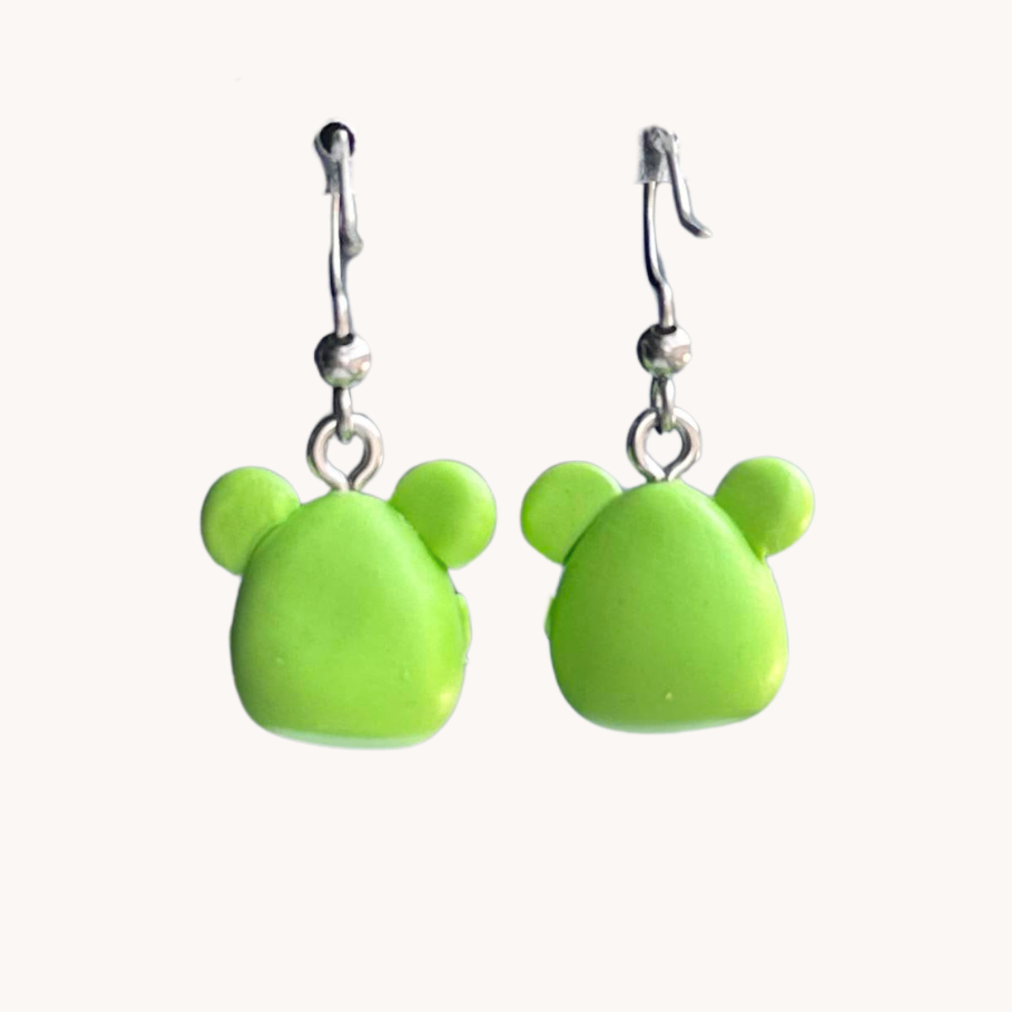 cute polymer clay green frog holding a daisy dangle earrings