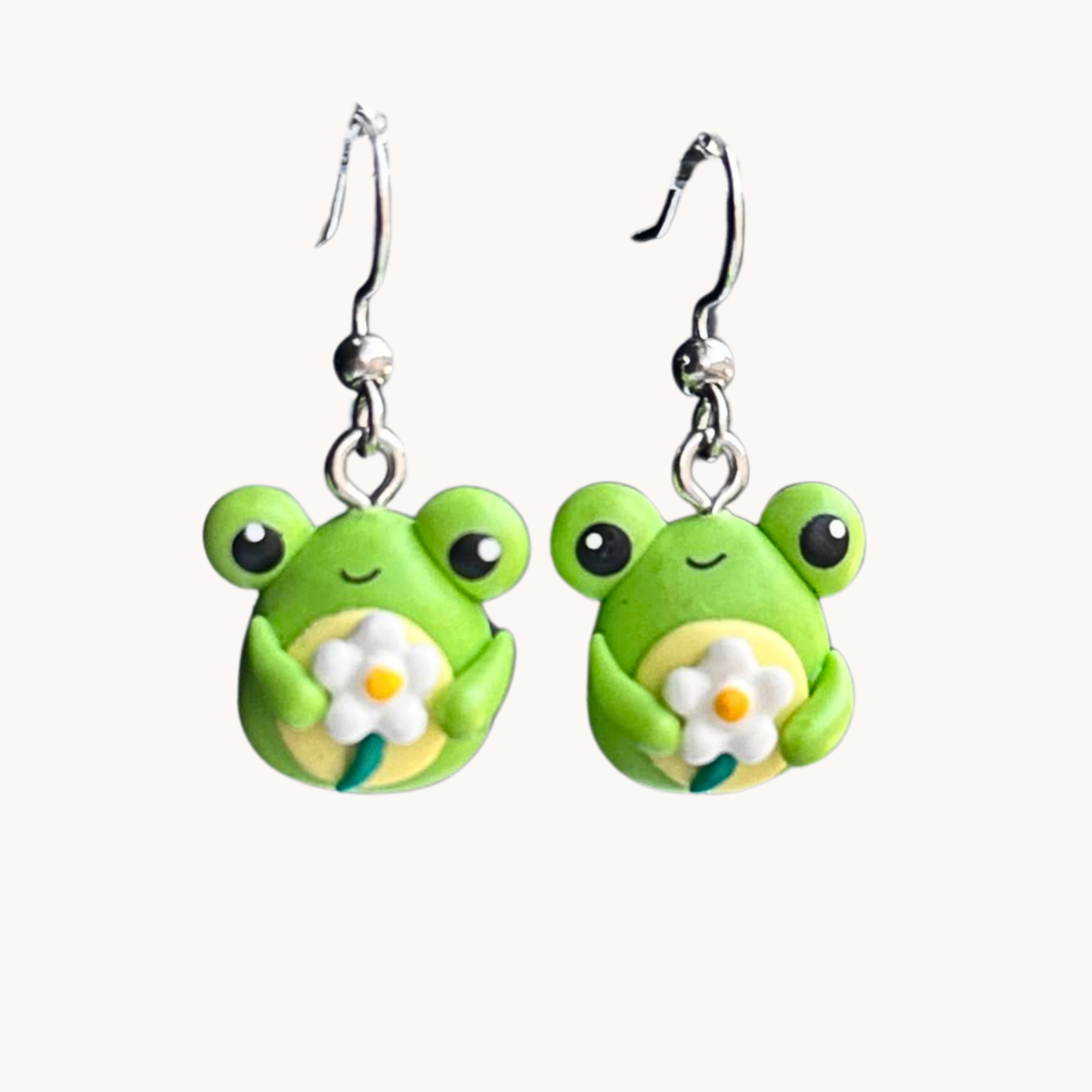 cute polymer clay green frog holding a daisy dangle earrings