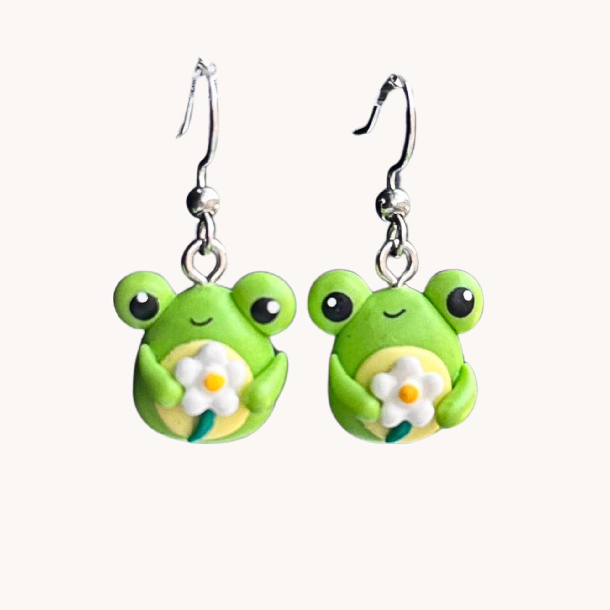 cute polymer clay green frog holding a daisy dangle earrings